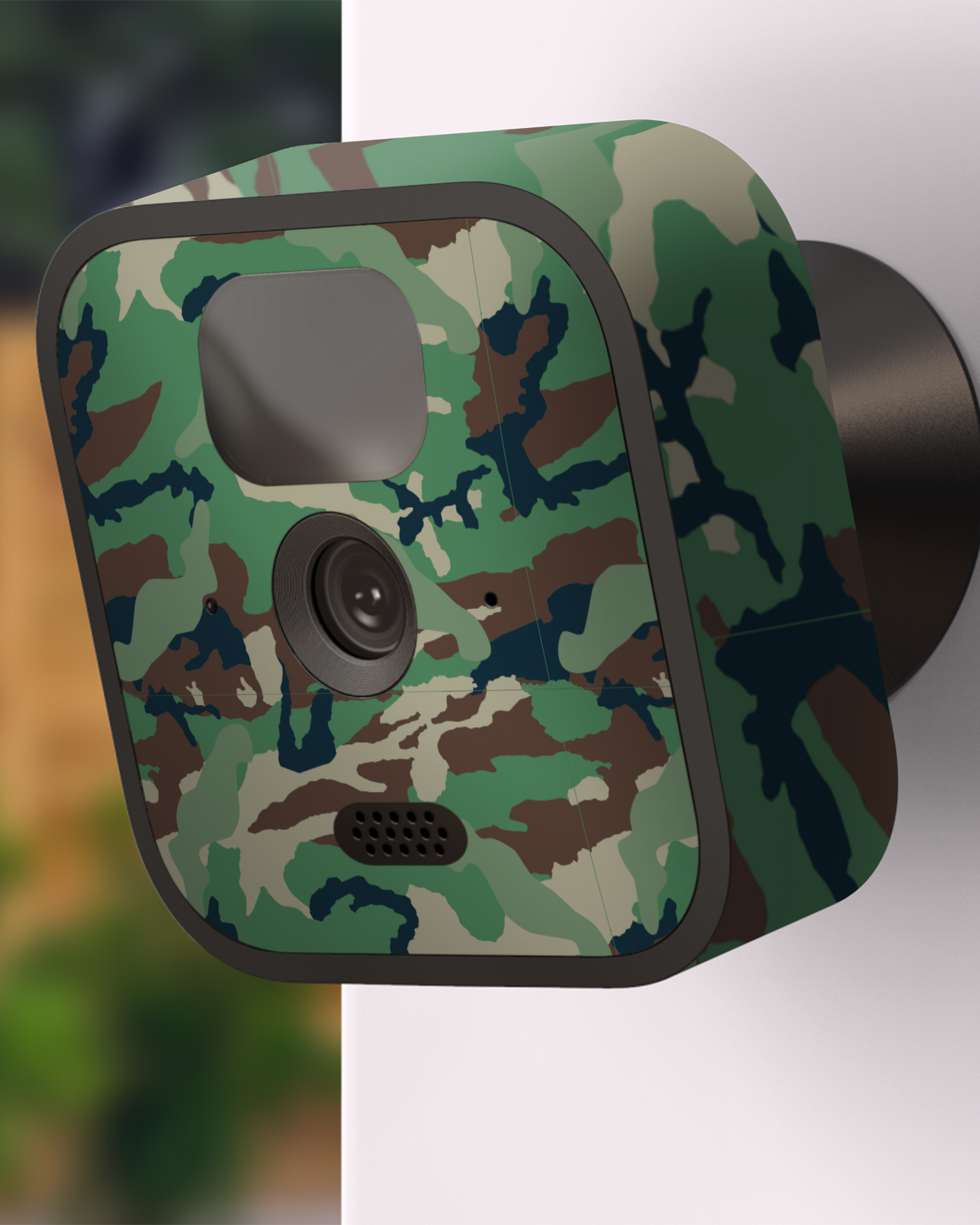 Green and Brown Camo Camera Skin Blink Outdoor (2020) attached to exterior wall