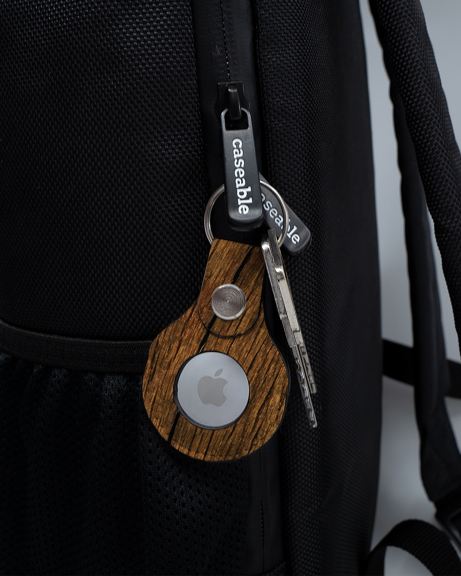 AirTag Holder with design Wood attached to a bag