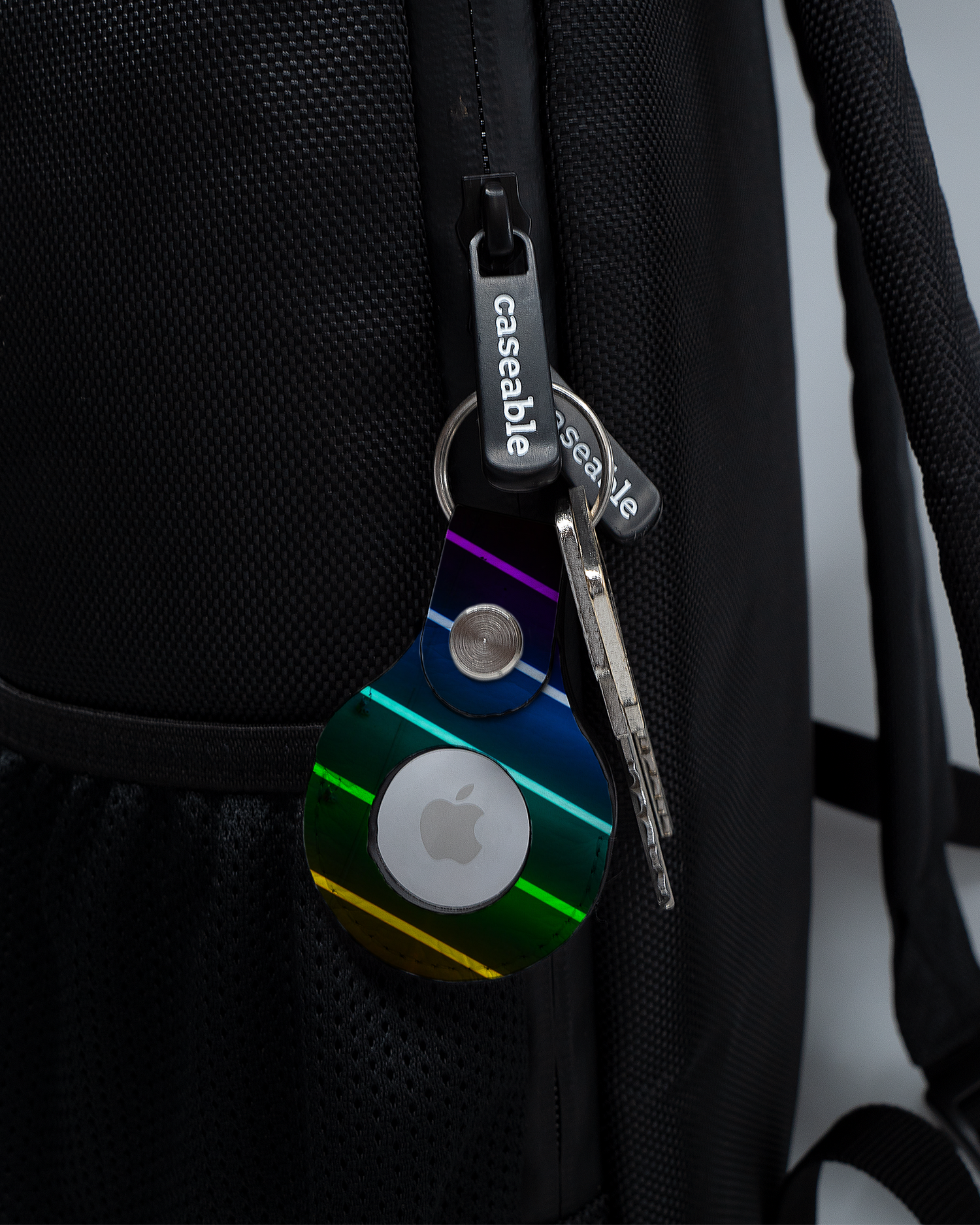 AirTag Holder with design LGBTQ attached to a bag