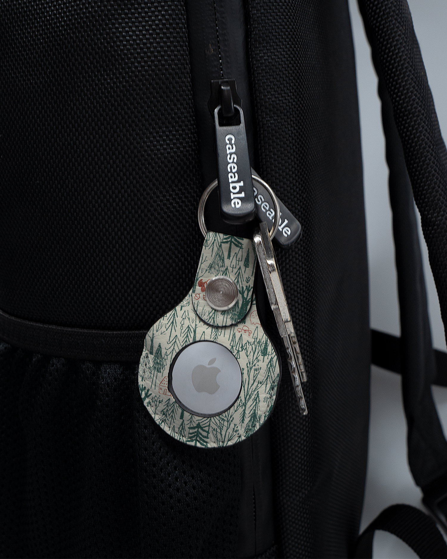 AirTag Holder with design Wonder Forest attached to a bag