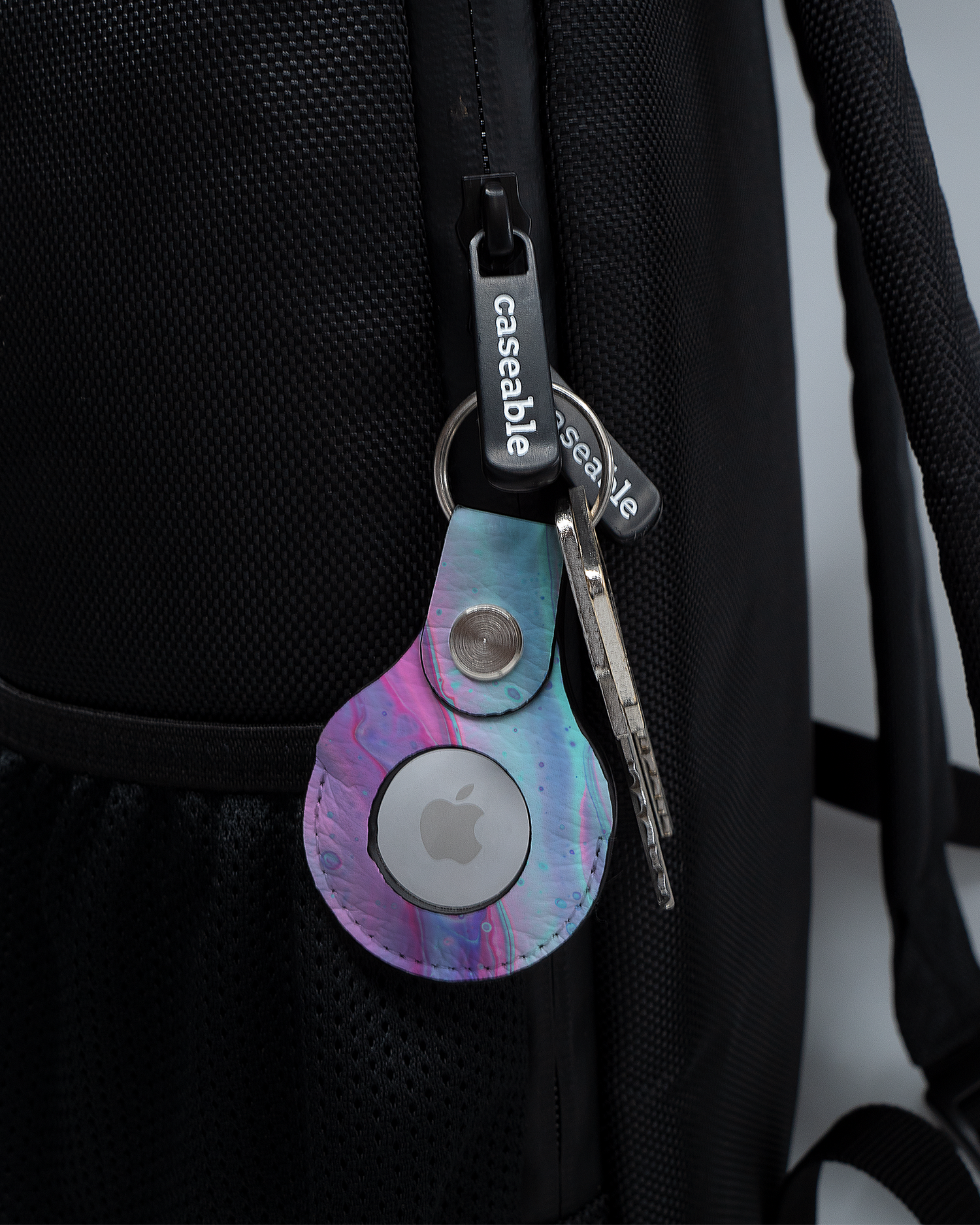 AirTag Holder with design Wavey attached to a bag