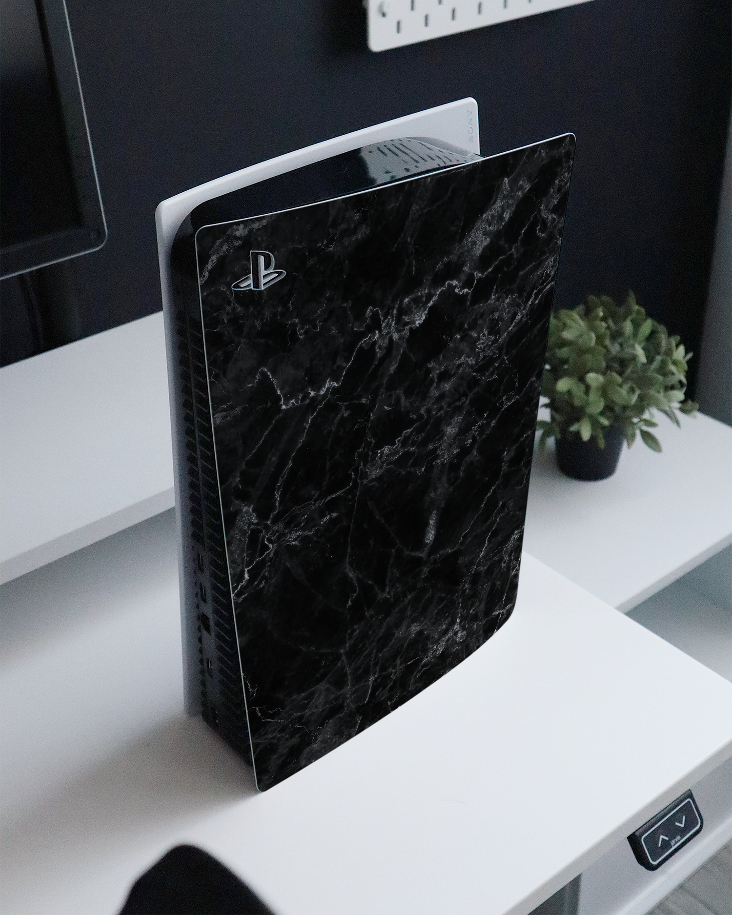 Midnight Marble Console Skin for Sony PlayStation 5 Digital Edition standing on a sideboard 