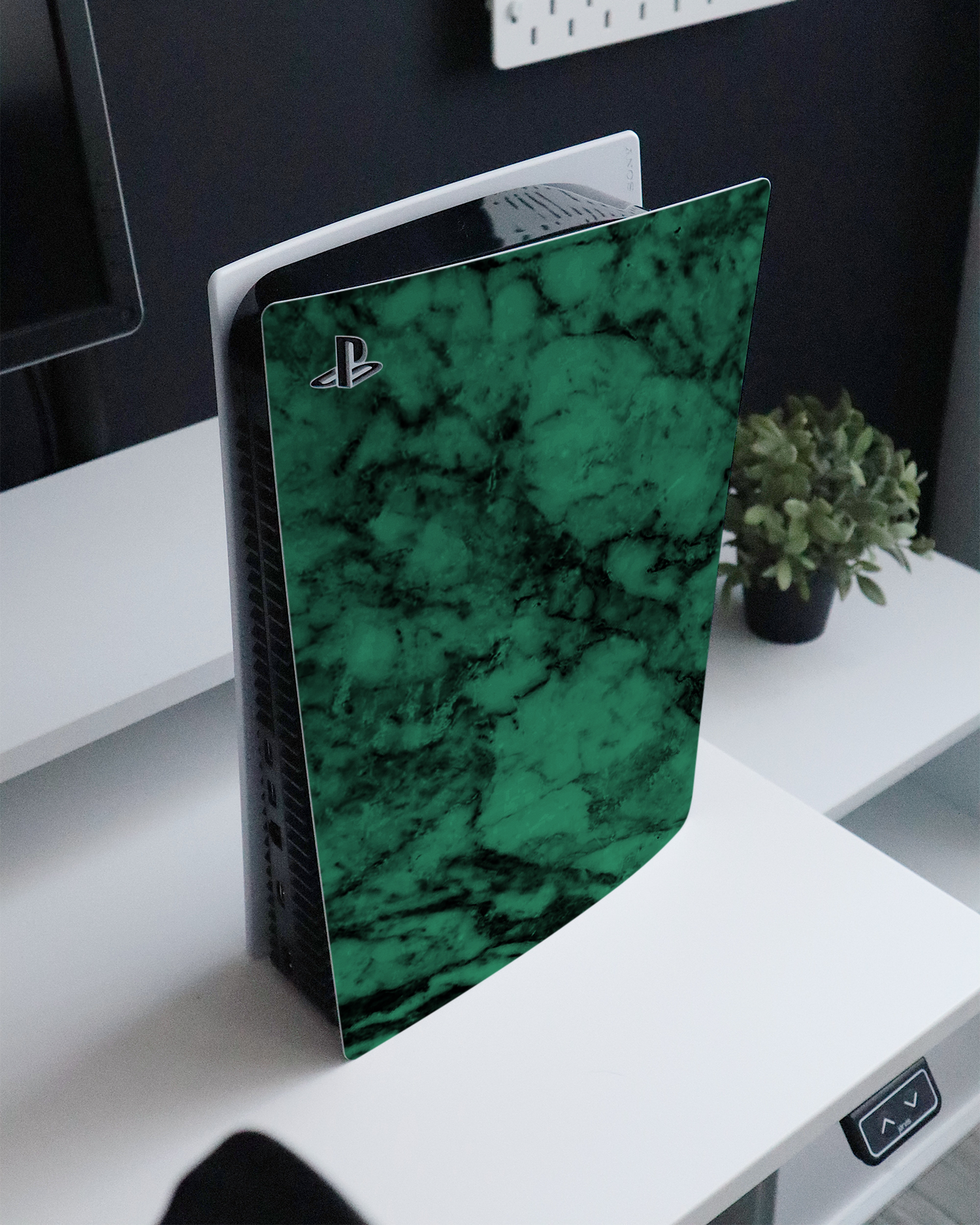 Green Marble Console Skin for Sony PlayStation 5 Digital Edition standing on a sideboard 