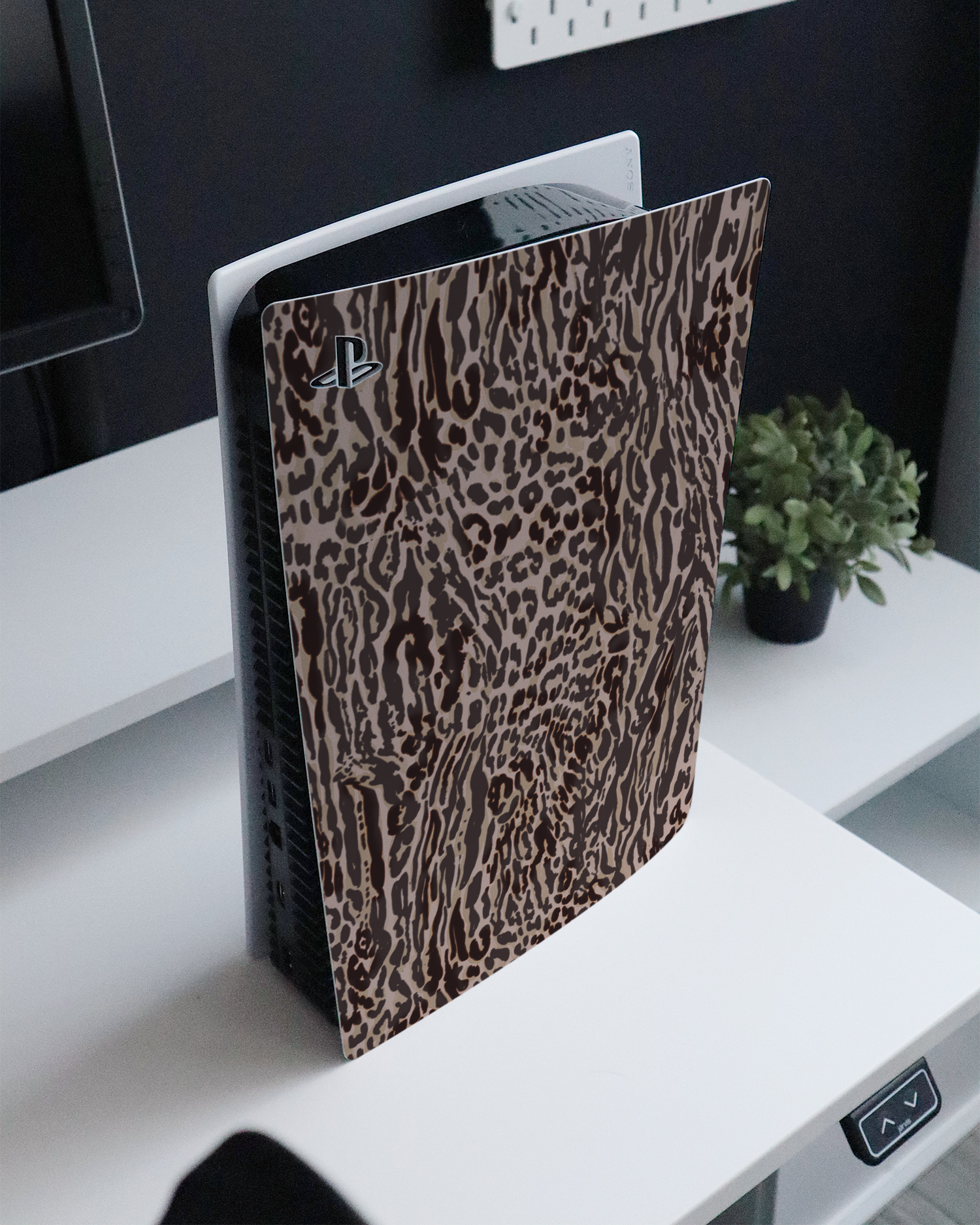 Animal Skin Tough Love Console Skin for Sony PlayStation 5 Digital Edition standing on a sideboard 