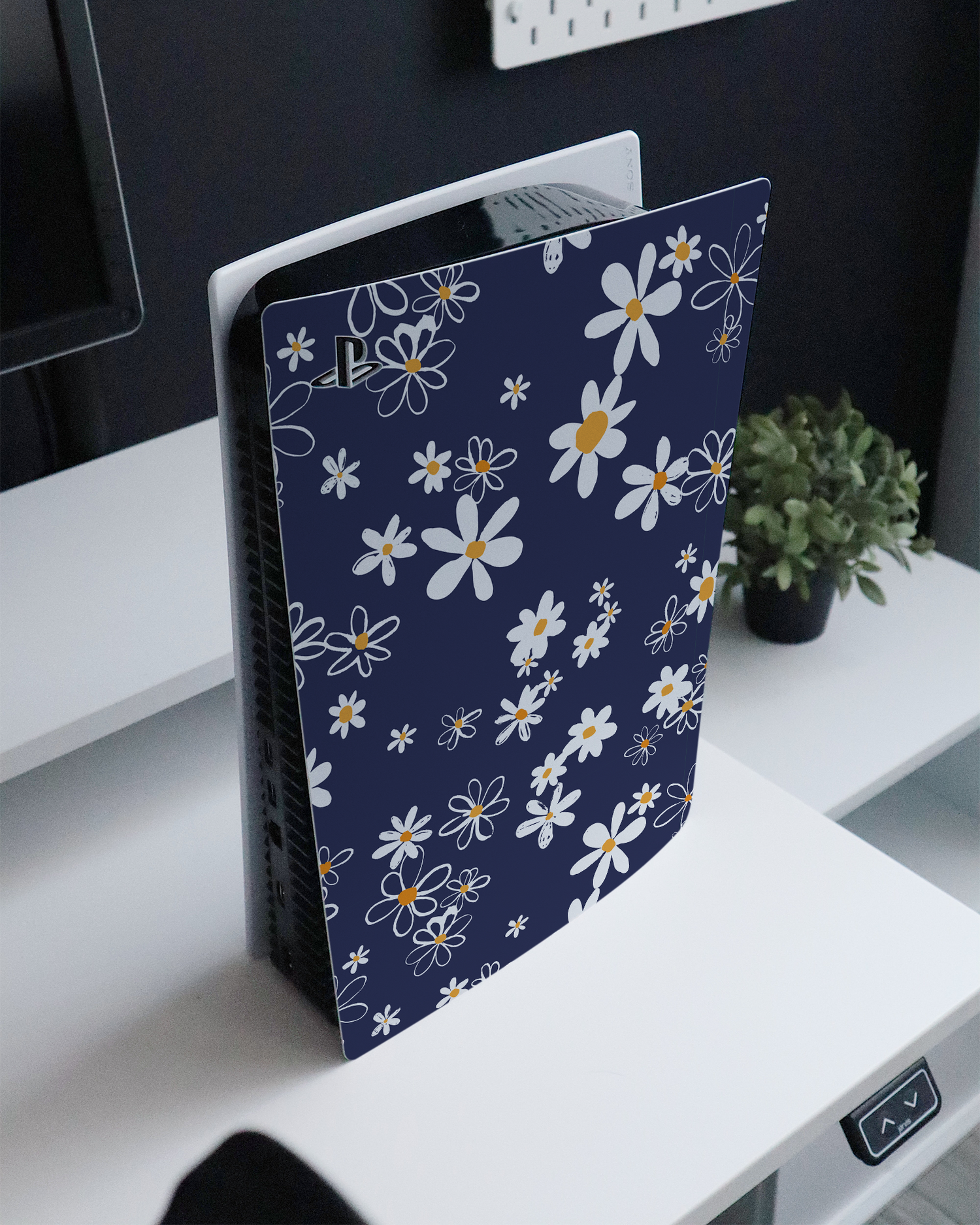 Navy Daisies Console Skin for Sony PlayStation 5 Digital Edition standing on a sideboard 