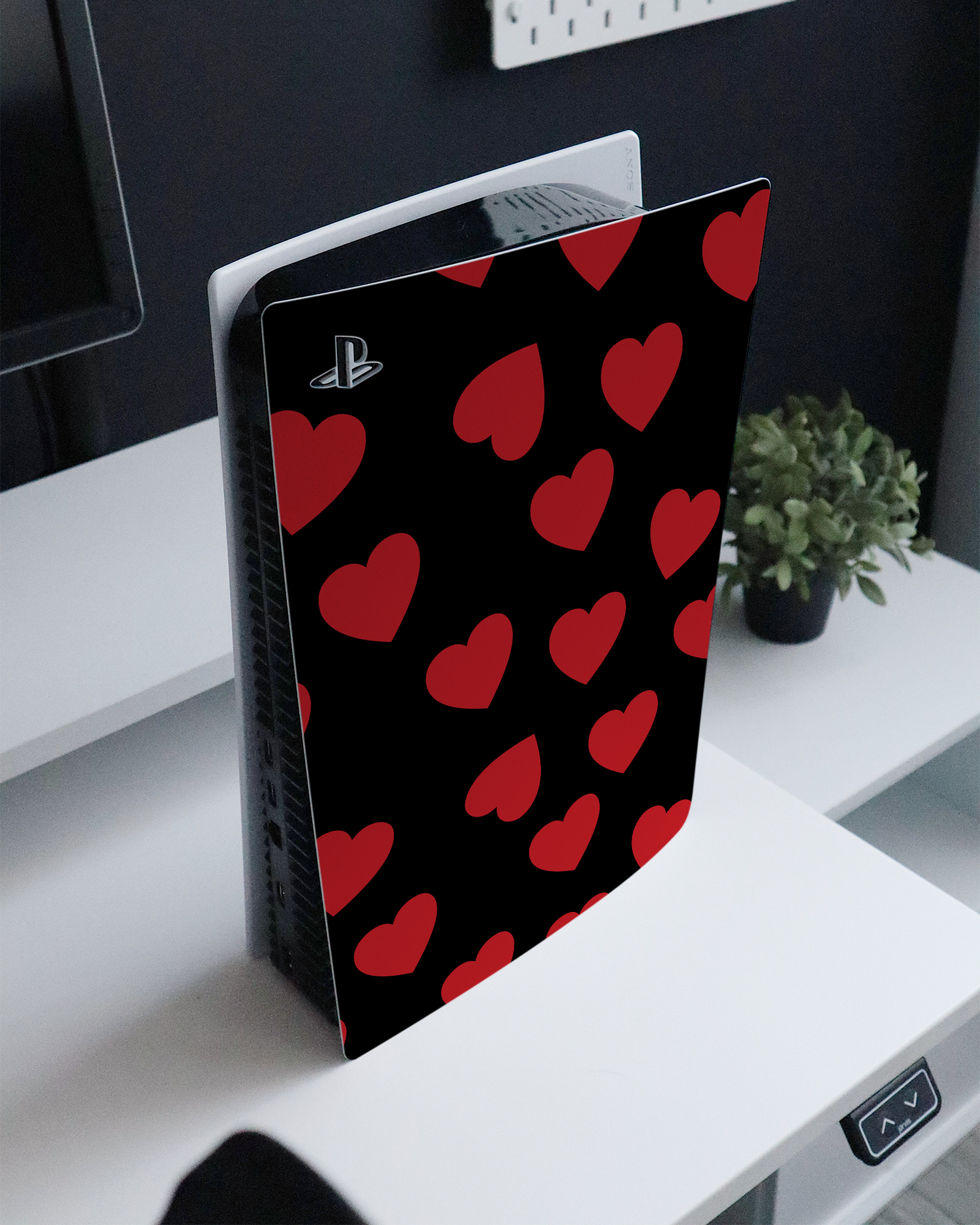 Repeating Hearts Console Skin for Sony PlayStation 5 Digital Edition standing on a sideboard 