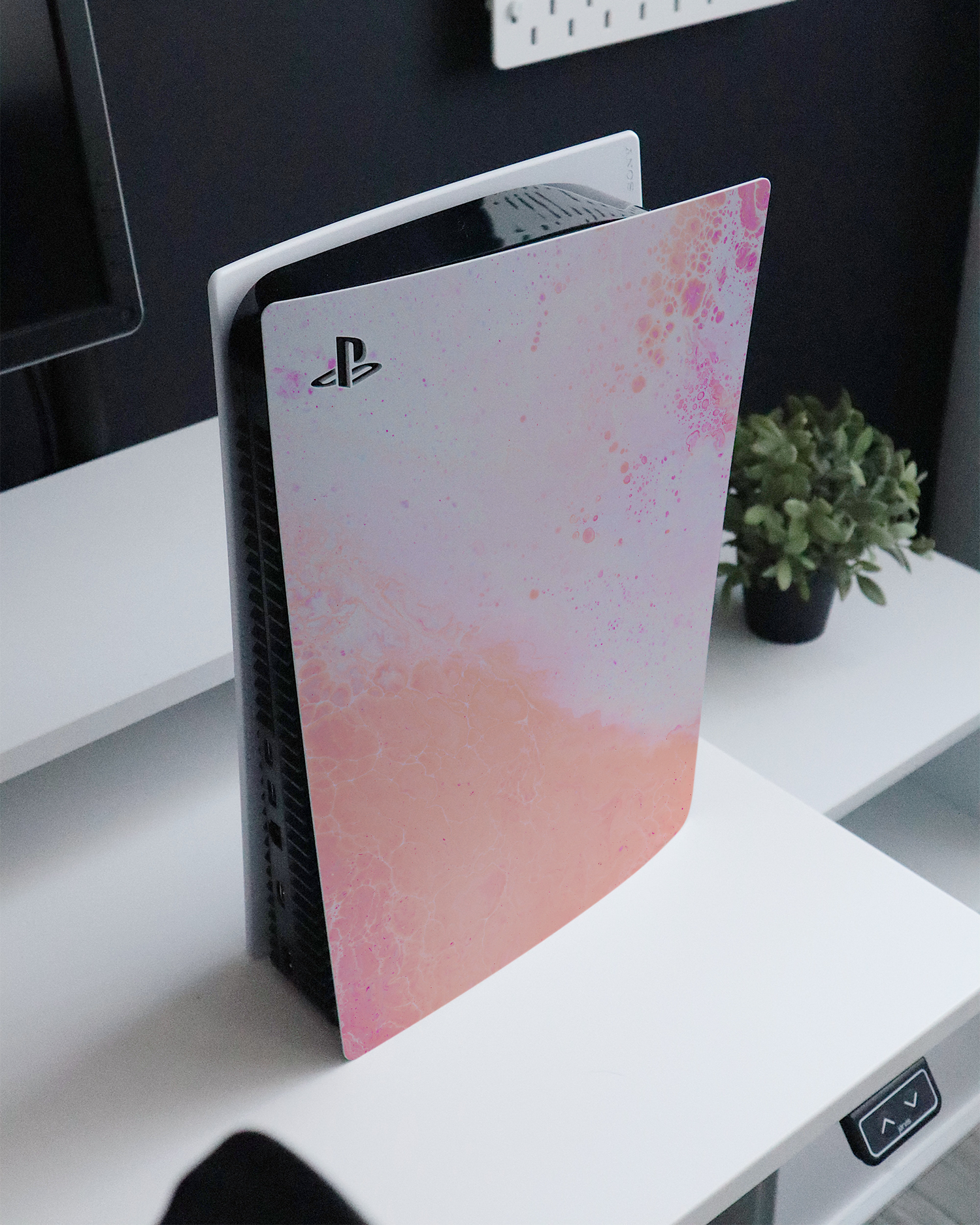 Peaches & Cream Marble Console Skin for Sony PlayStation 5 Digital Edition standing on a sideboard 