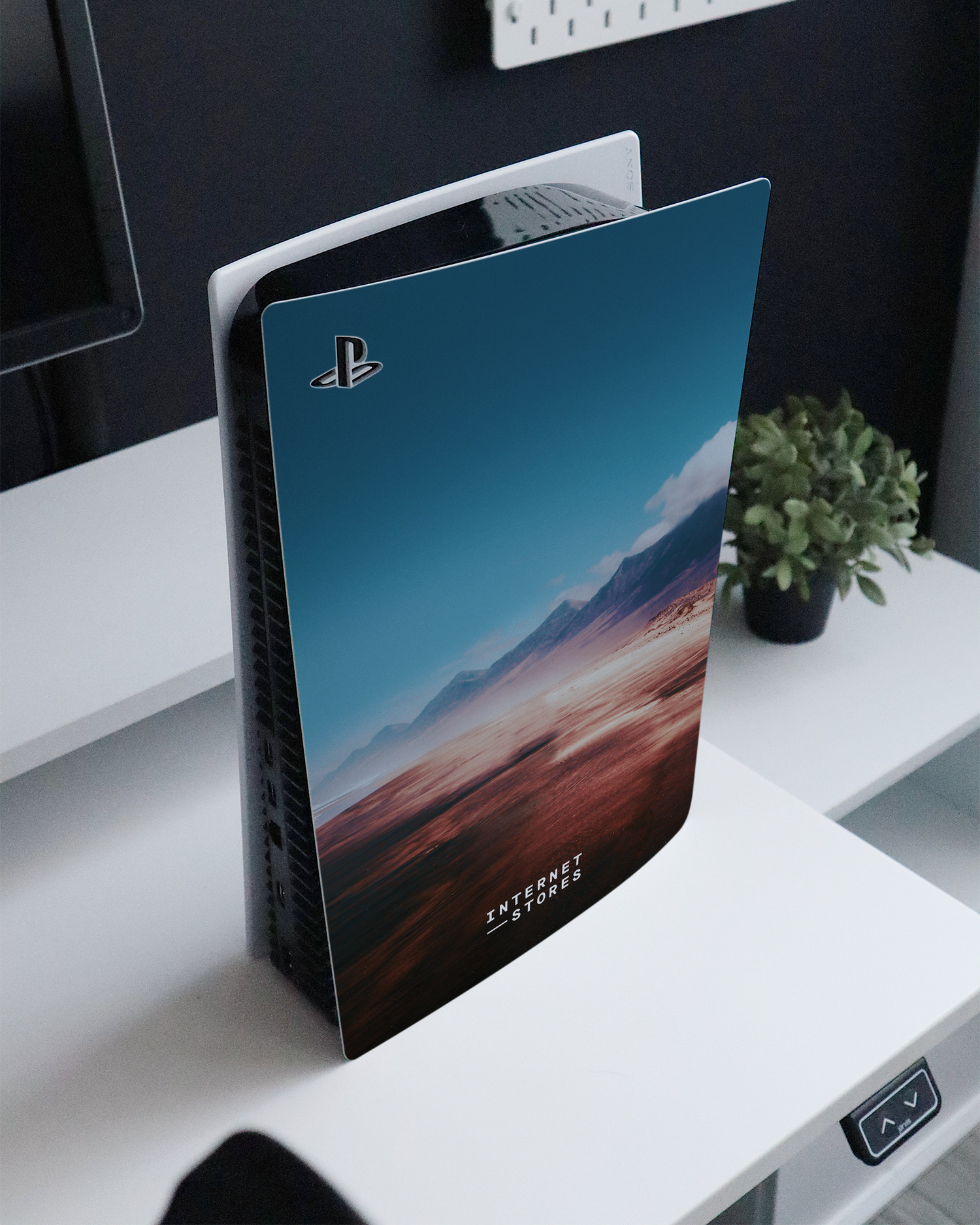 Sky Console Skin for Sony PlayStation 5 standing on a sideboard 