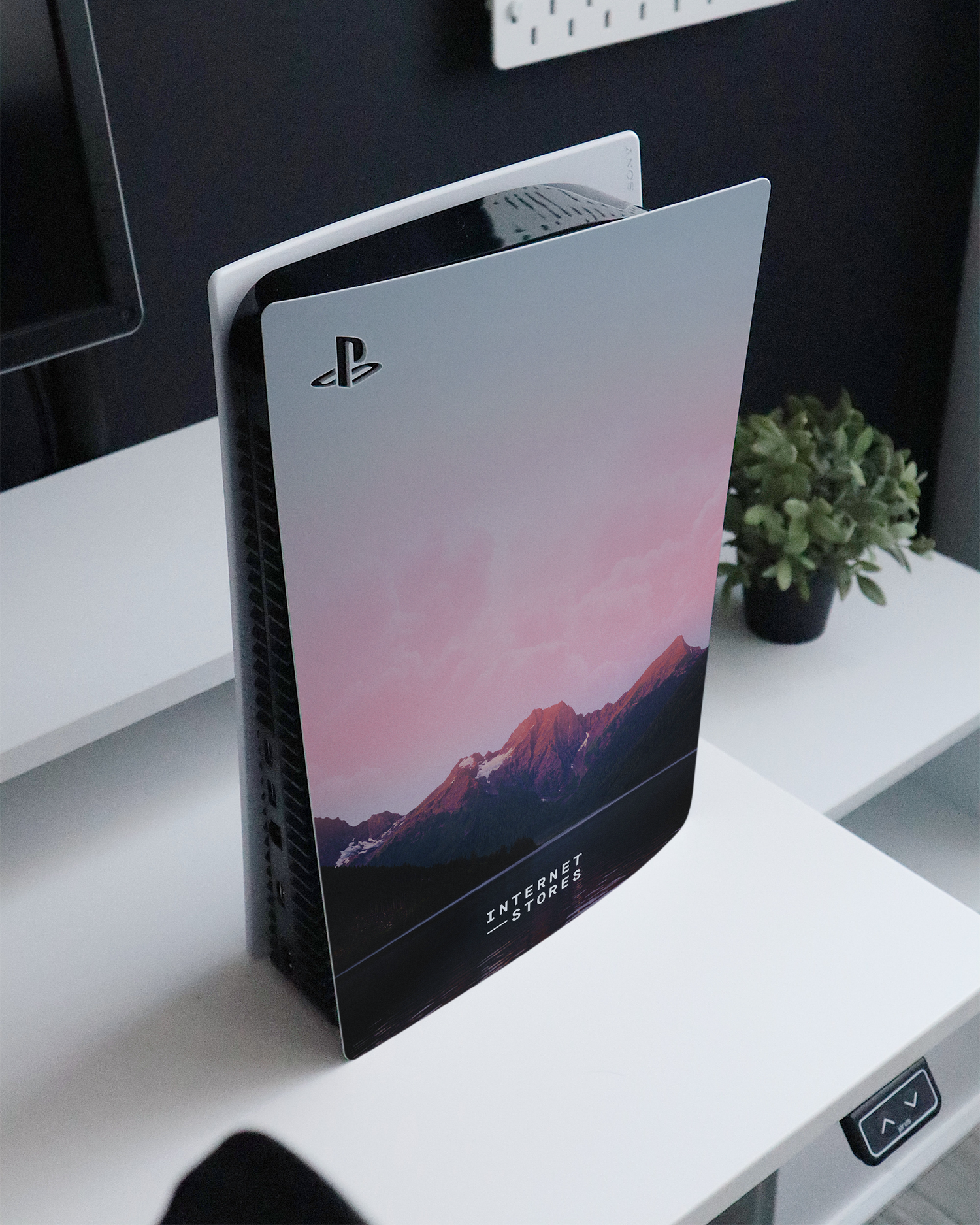 Lake Console Skin for Sony PlayStation 5 standing on a sideboard 