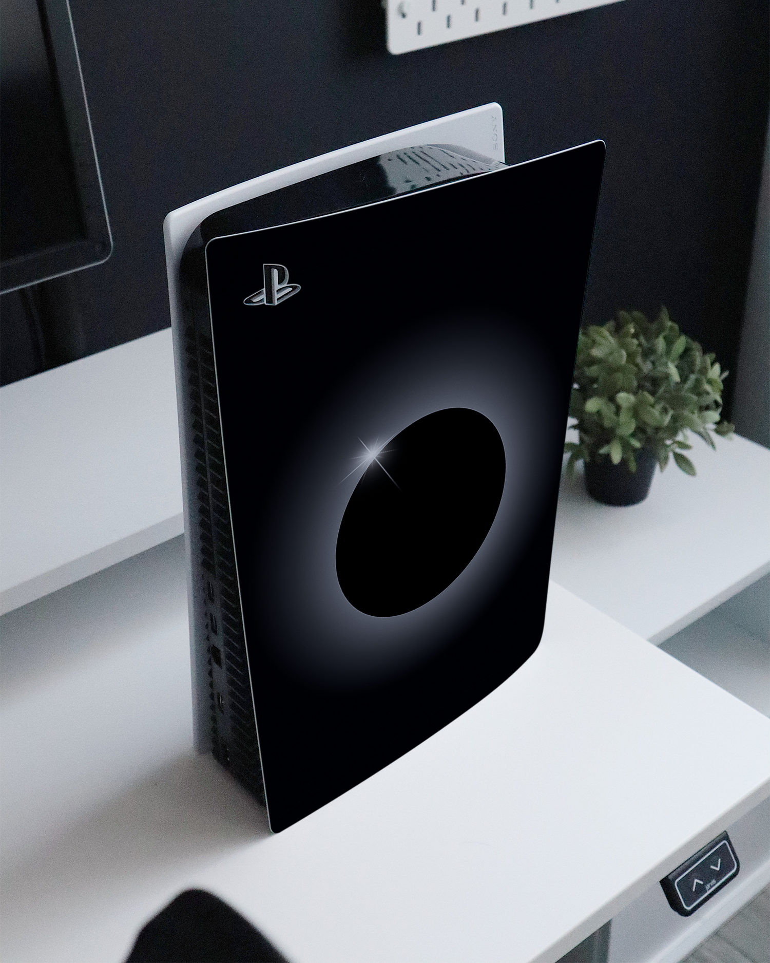 Eclipse Console Skin for Sony PlayStation 5 standing on a sideboard 