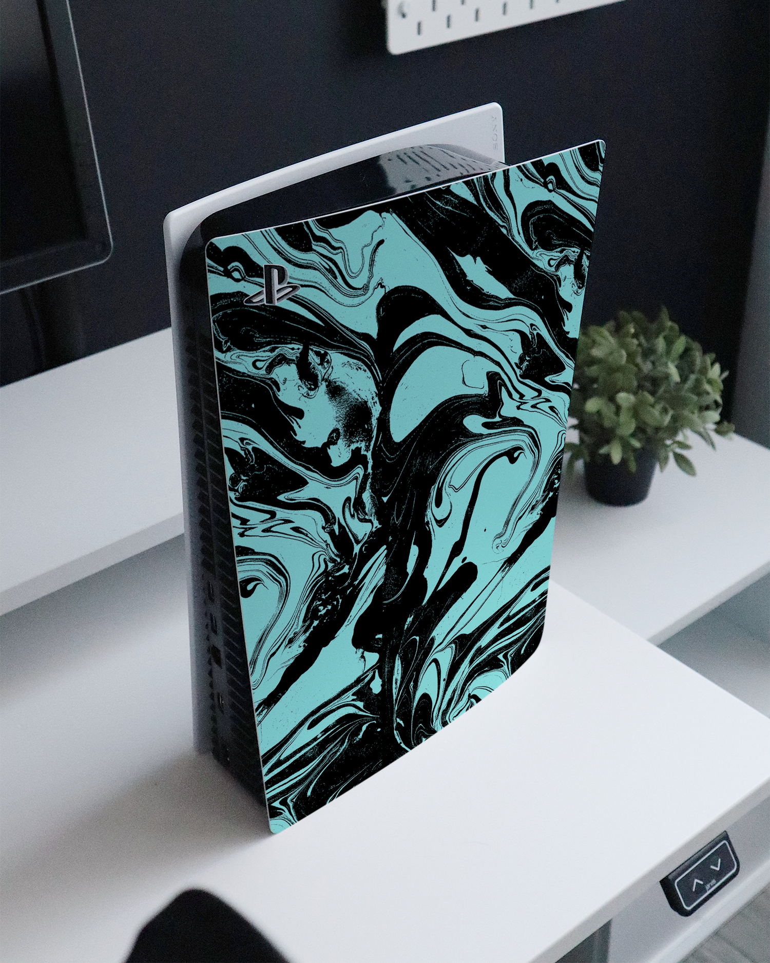 Mint Swirl Console Skin for Sony PlayStation 5 standing on a sideboard 
