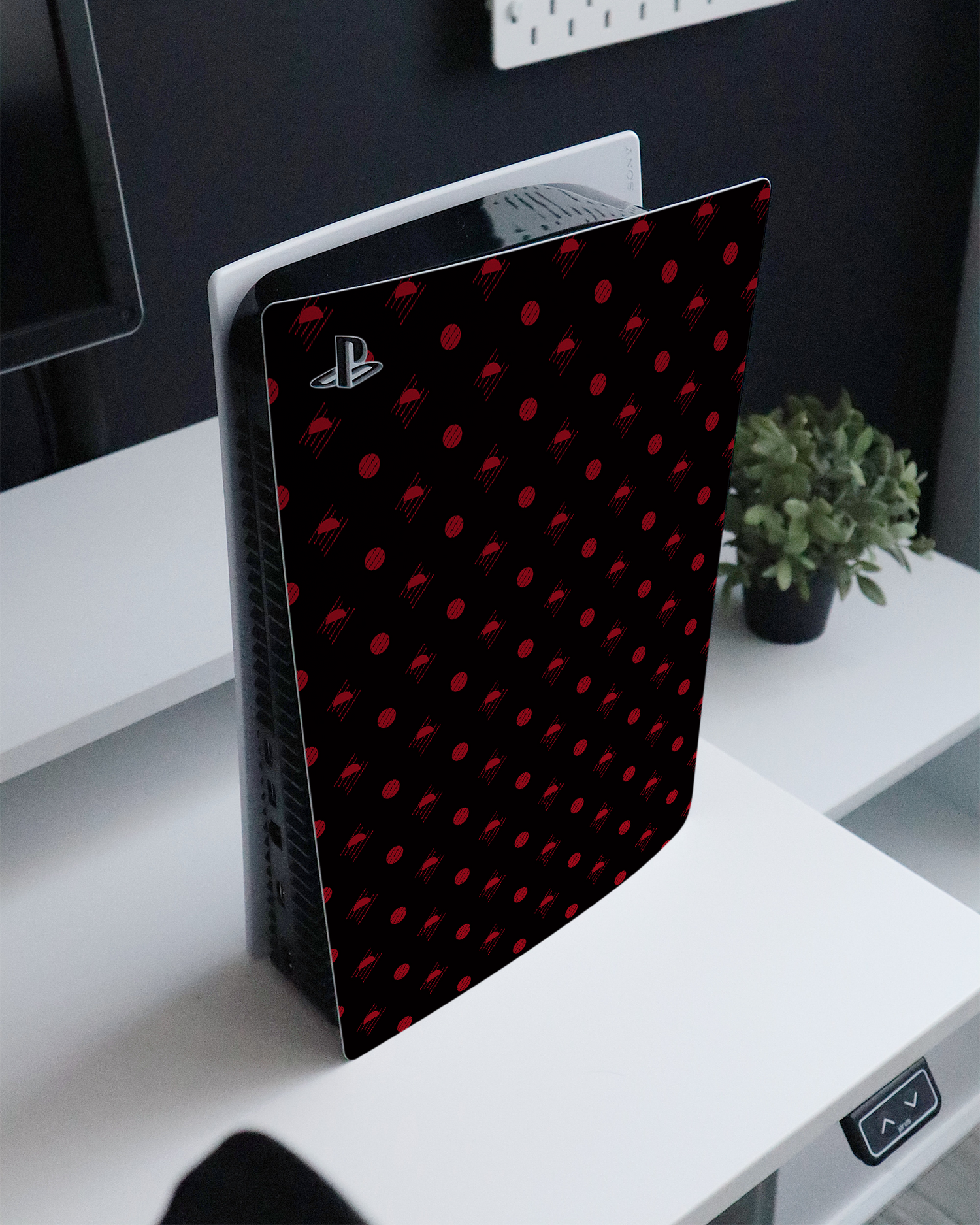 Dot Distrupt Console Skin for Sony PlayStation 5 standing on a sideboard 