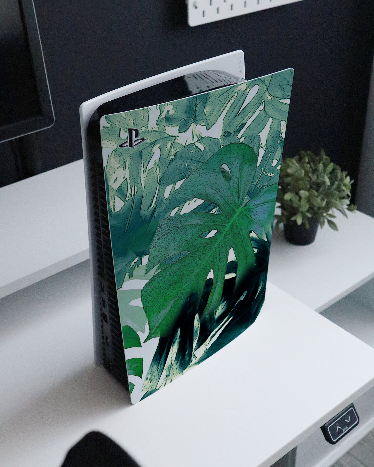 Saturated Plants Console Skin for Sony PlayStation 5 standing on a sideboard 