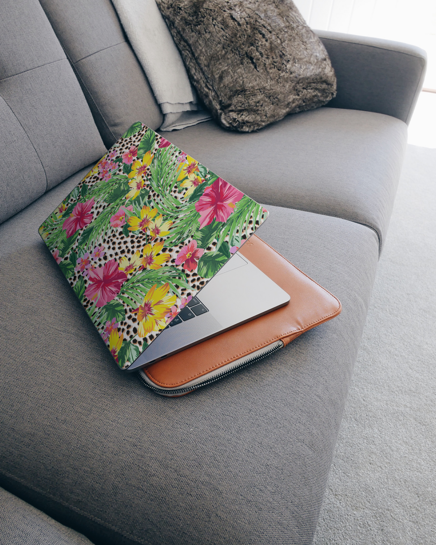 Tropical Cheetah Laptop Skin for 15 inch Apple MacBooks on a couch