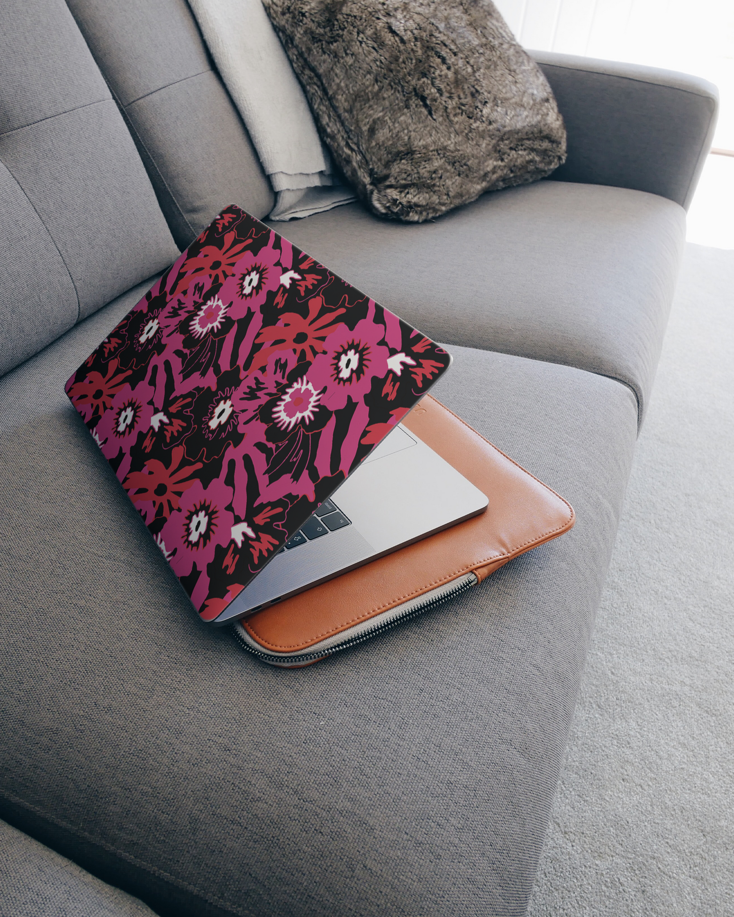 Flower Works Laptop Skin for 15 inch Apple MacBooks on a couch