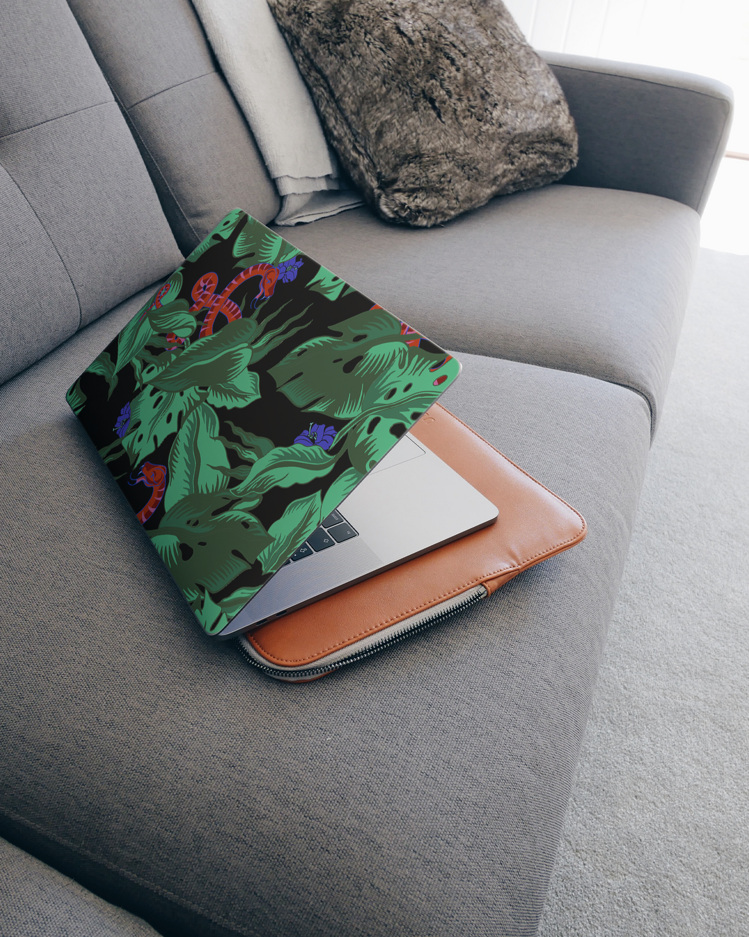 Tropical Snakes Laptop Skin for 15 inch Apple MacBooks on a couch