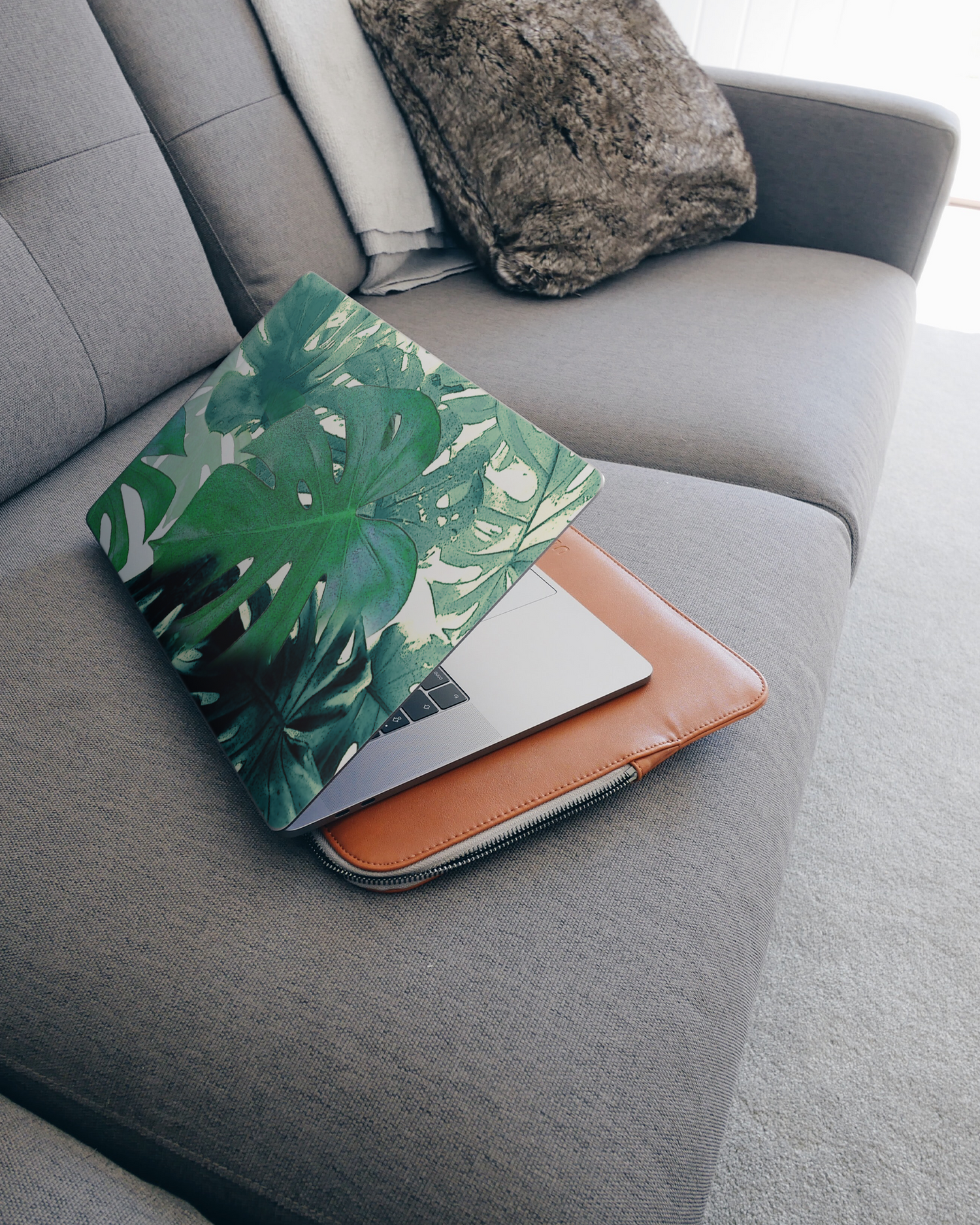 Saturated Plants Laptop Skin for 15 inch Apple MacBooks on a couch