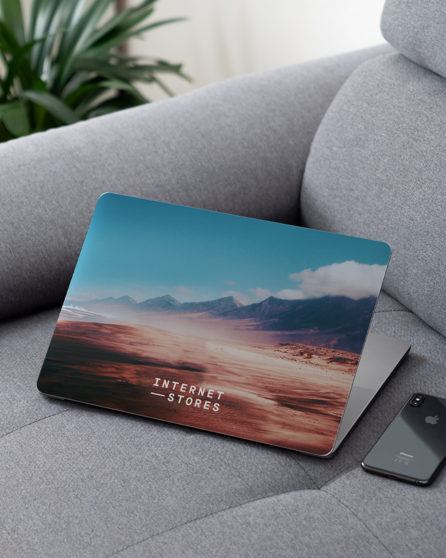 Sky Laptop Skin for 13 inch Apple MacBooks on a couch