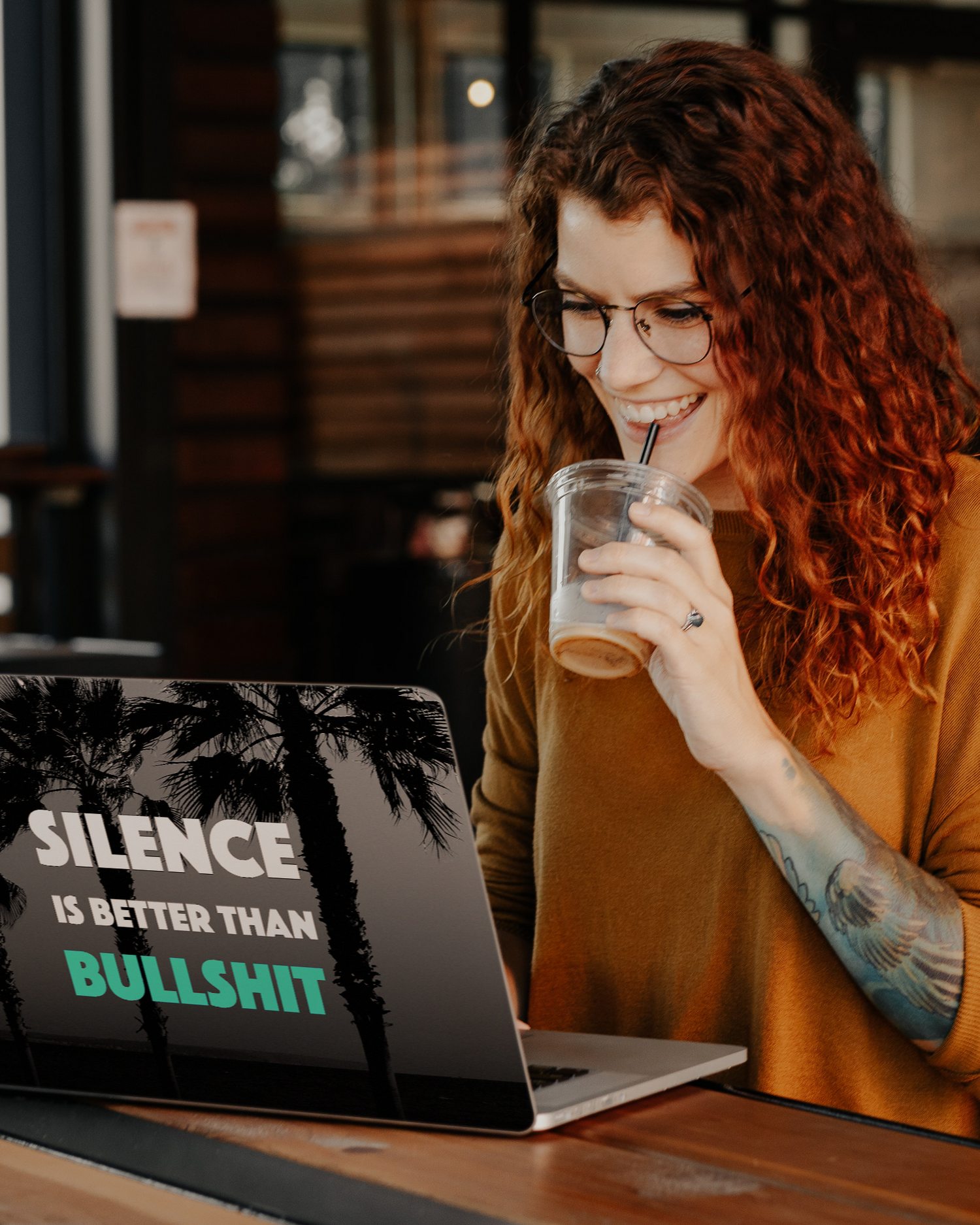 Silence Is Better Laptop Skin for 13 inch Apple MacBooks in a bar