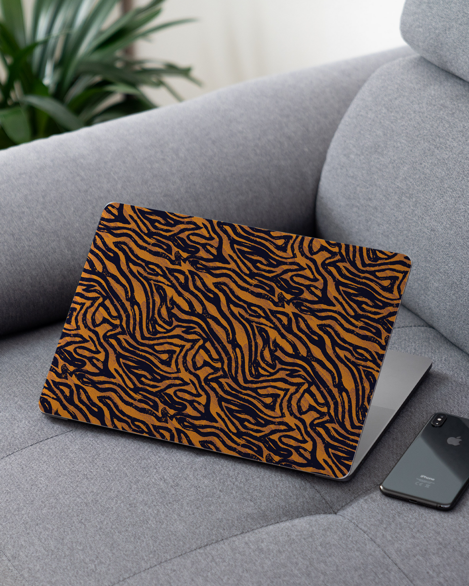 Tiger Zebra Skins Laptop Skin for 13 inch Apple MacBooks on a couch