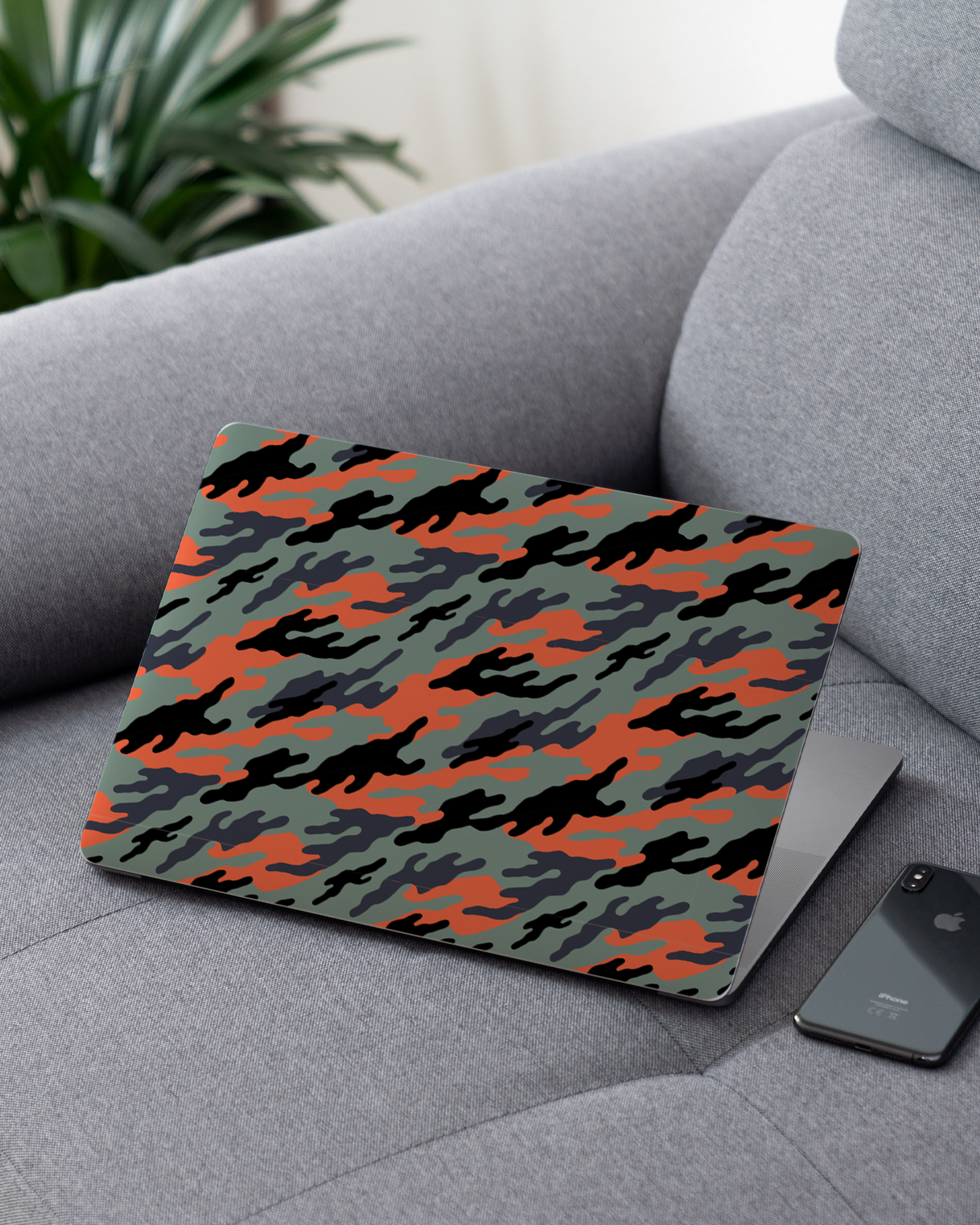 Camo Sunset Laptop Skin for 13 inch Apple MacBooks on a couch