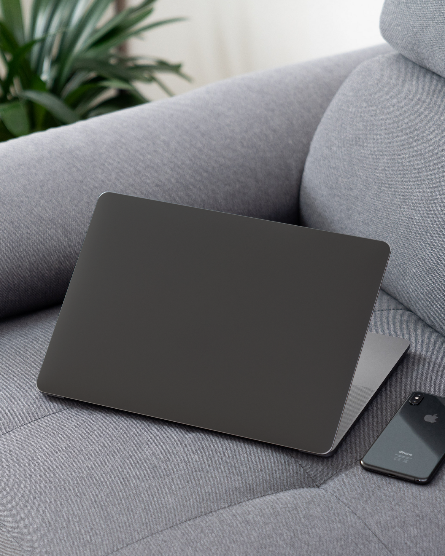 SPACE GREY Laptop Skin for 13 inch Apple MacBooks on a couch
