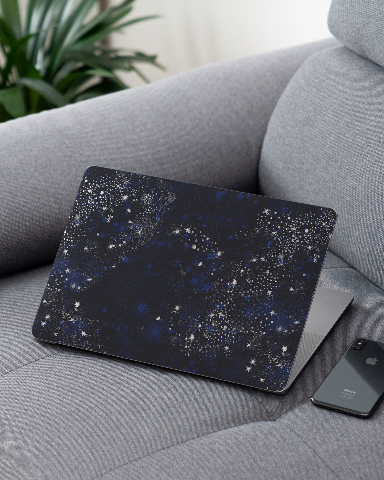 Starry Night Sky Laptop Skin for 13 inch Apple MacBooks on a couch