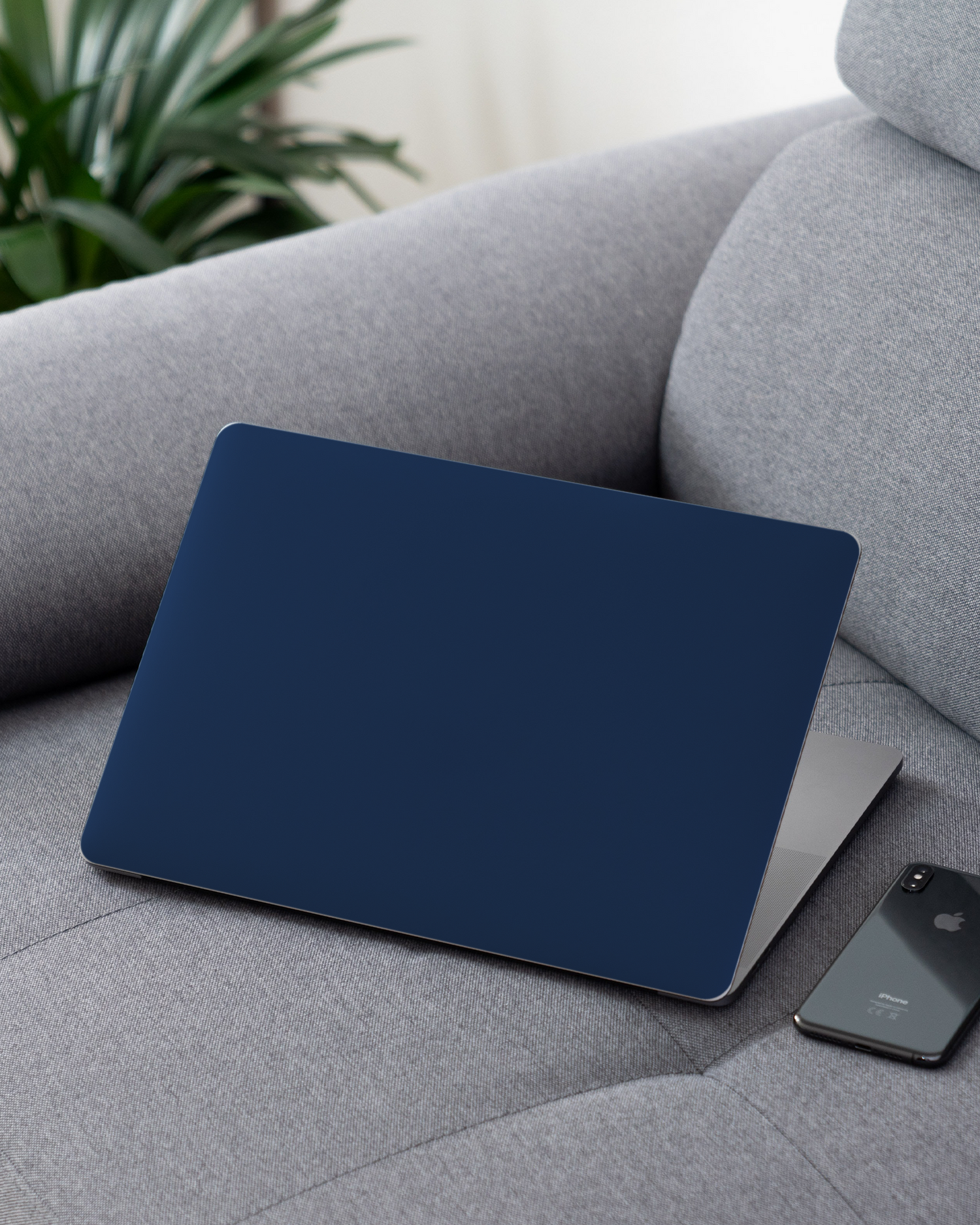 NAVY Laptop Skin for 13 inch Apple MacBooks on a couch