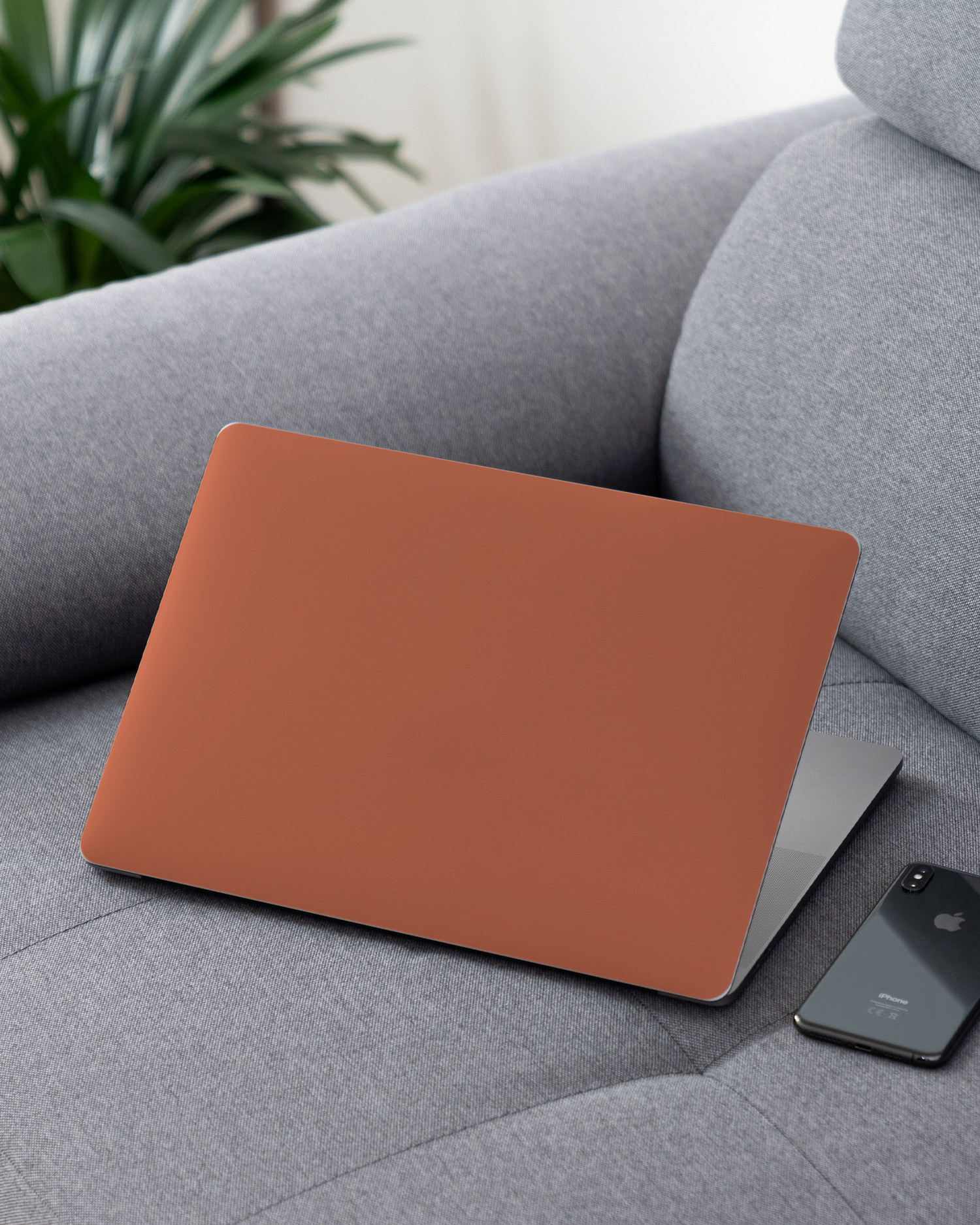 DUSTY CLAY Laptop Skin for 13 inch Apple MacBooks on a couch