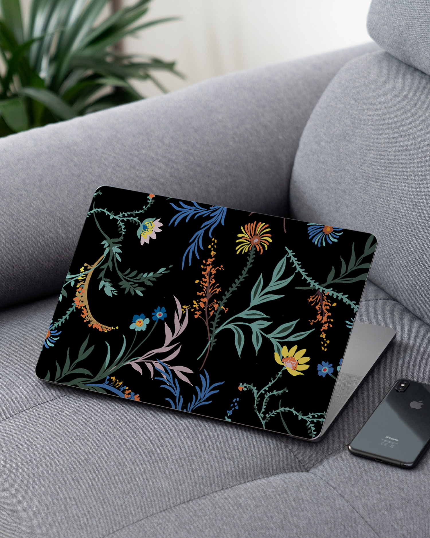 Woodland Spring Floral Laptop Skin for 13 inch Apple MacBooks on a couch