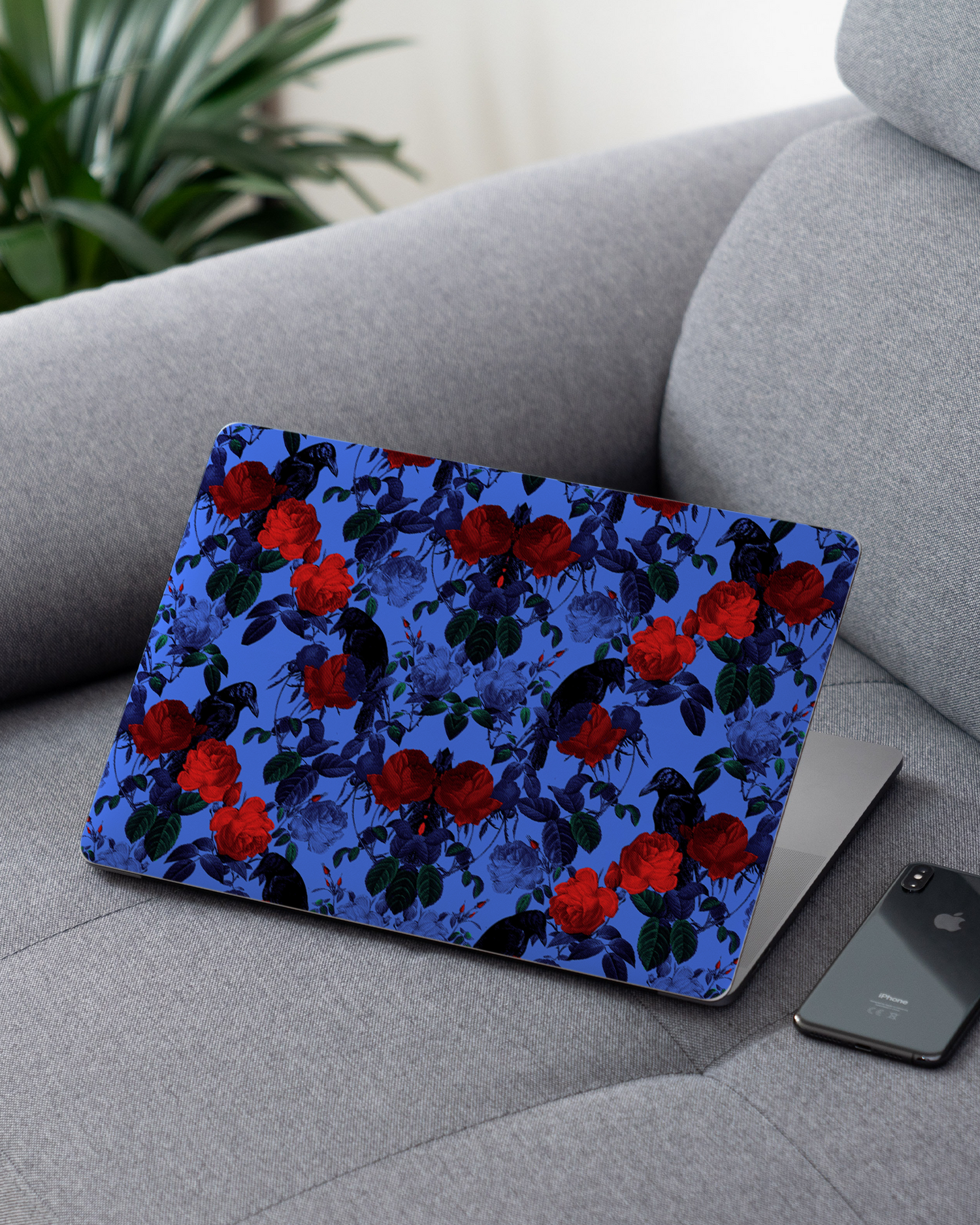 Roses And Ravens Laptop Skin for 13 inch Apple MacBooks on a couch