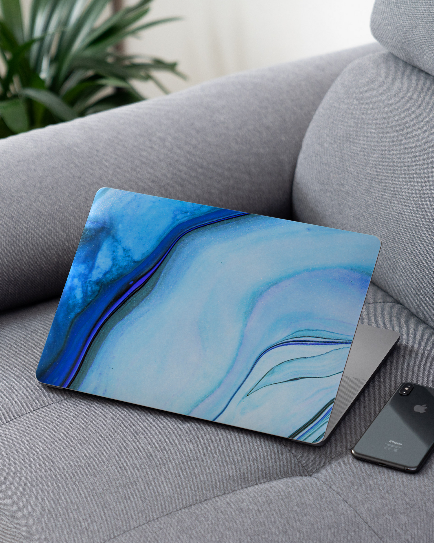 Cool Blues Laptop Skin for 13 inch Apple MacBooks on a couch