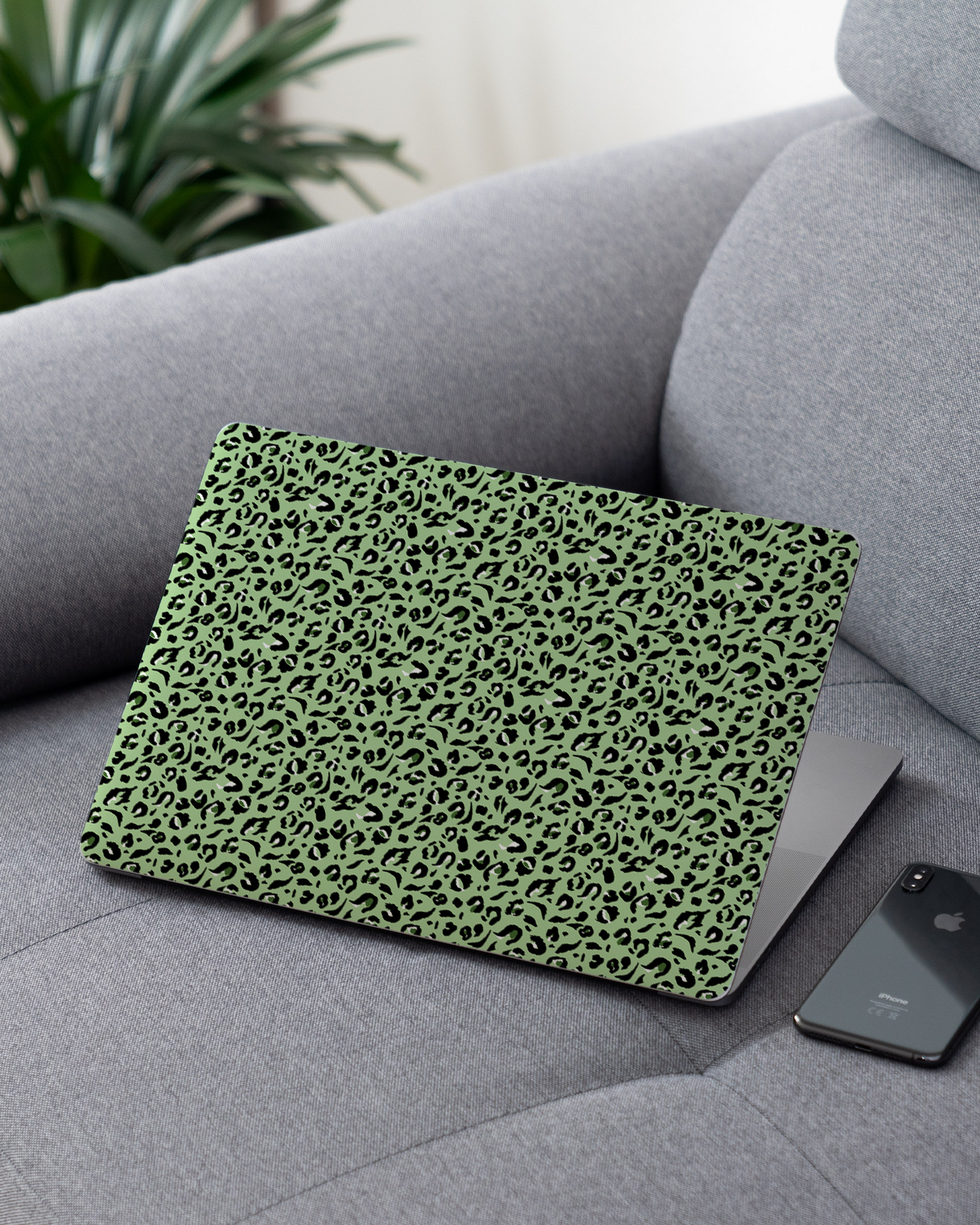 Mint Leopard Laptop Skin for 13 inch Apple MacBooks on a couch