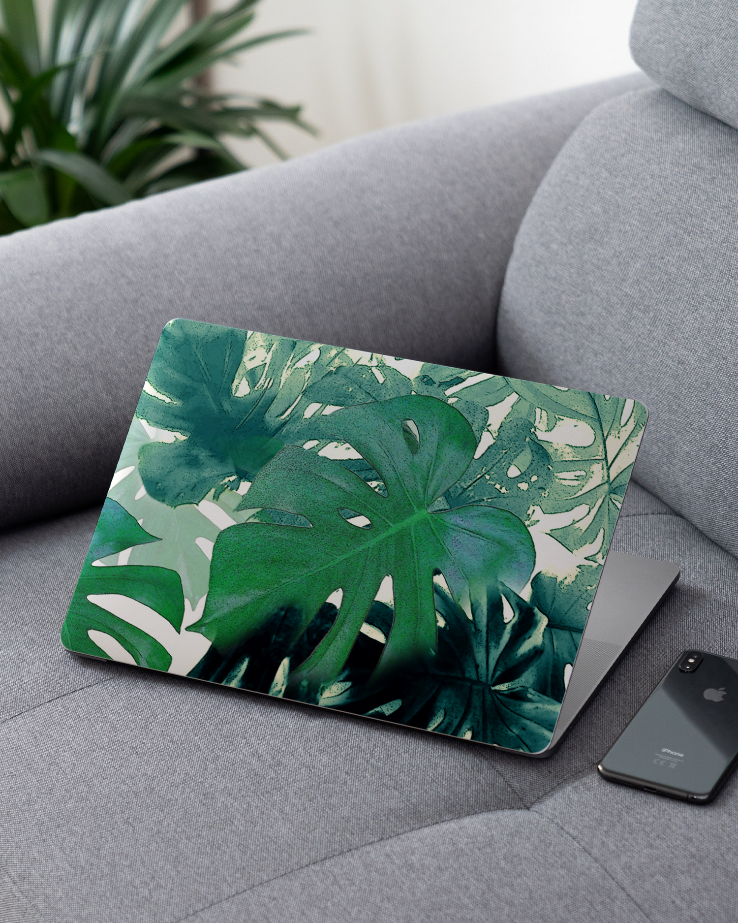 Saturated Plants Laptop Skin for 13 inch Apple MacBooks on a couch